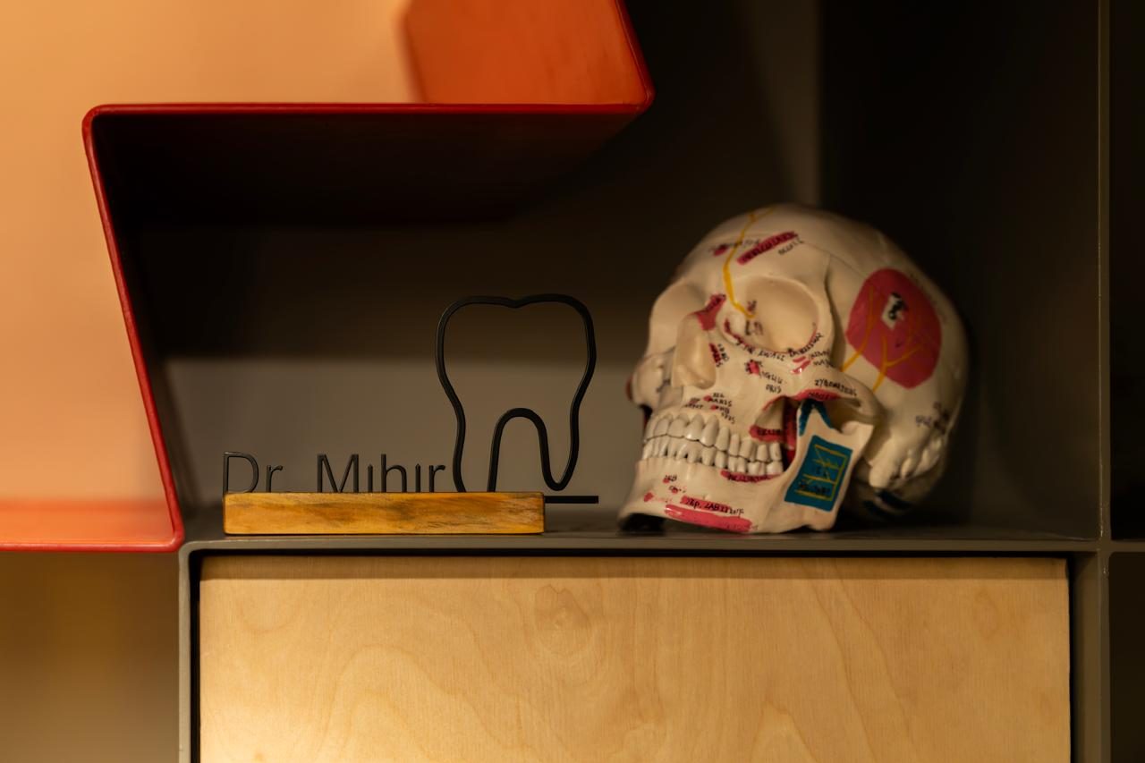 Dr. Mihir Shah's nameplate beside an anatomical model